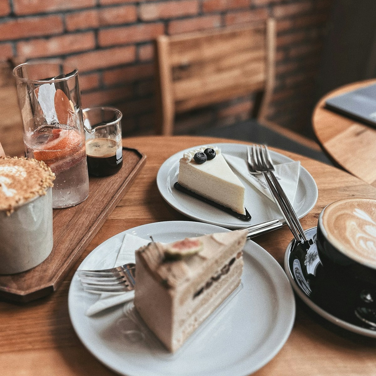 a piece of cake and a cup of coffee on a table